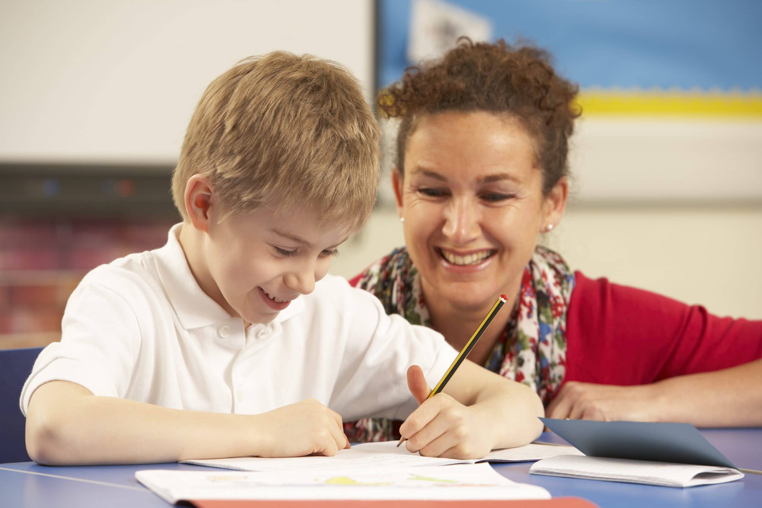 Teacher and child smiling