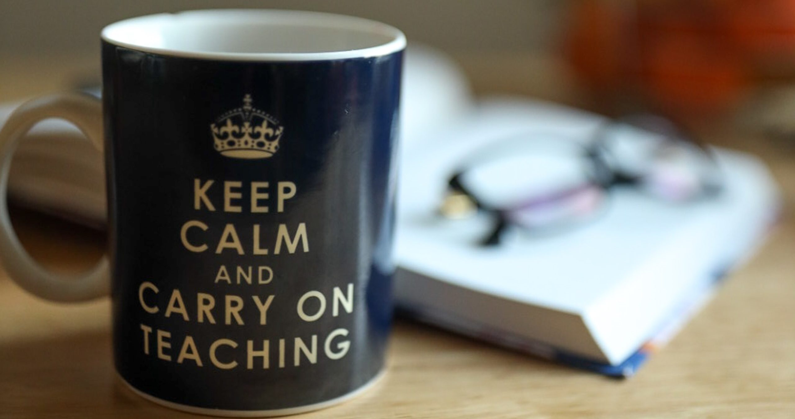 Keep calm and carry on teaching motto on a mug