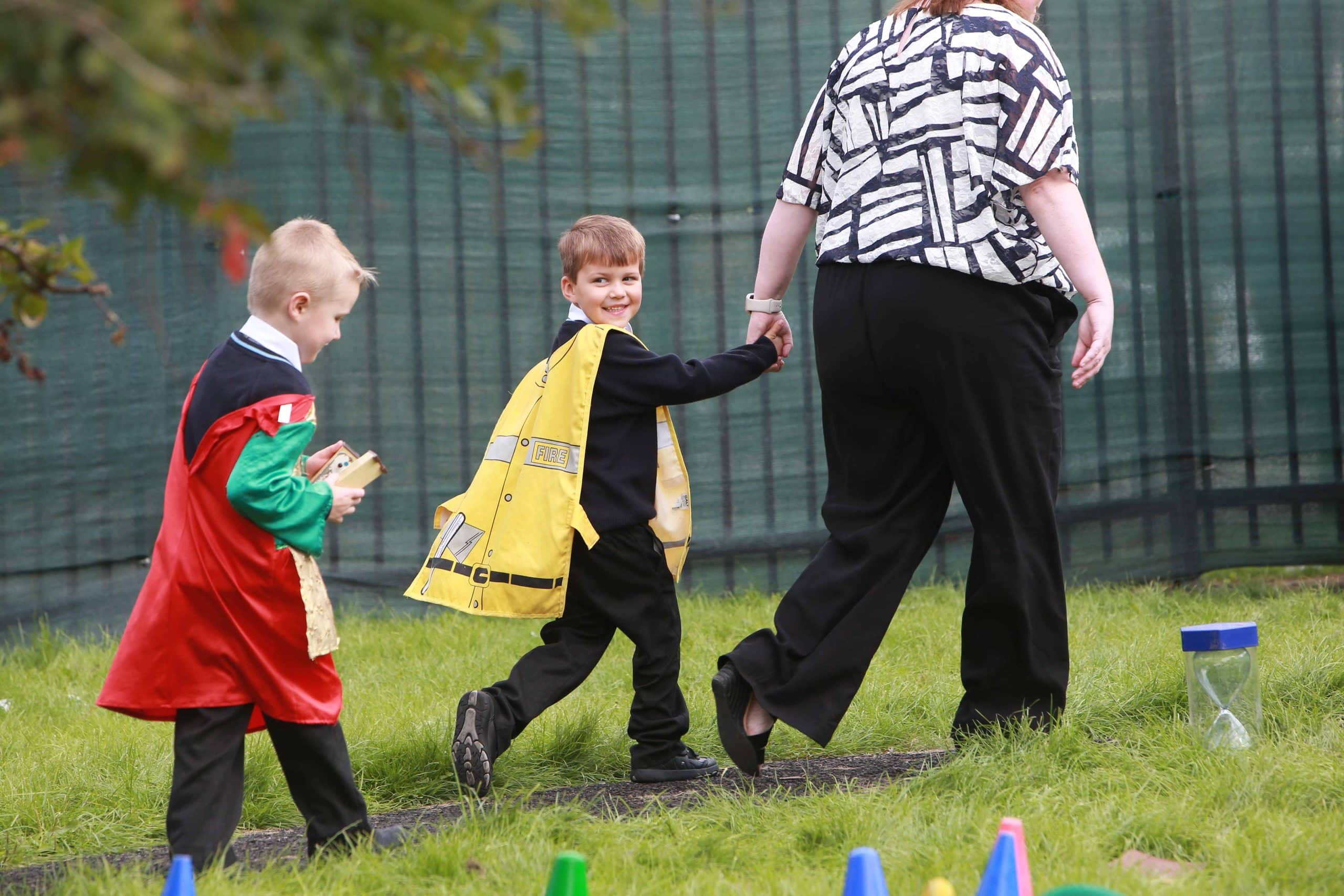 Warrington Primary Academy Trust children with a teacher on the school field
